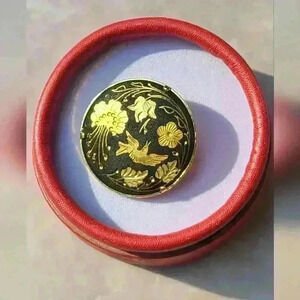 Vintage Damascene  brooches gold tone with black background gold flower and bird